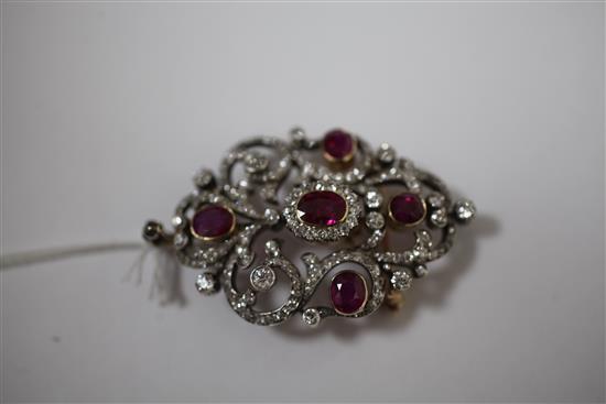 An attractive early 20th century gold and platinum, ruby and diamond pendant brooch, overall 2.5in.